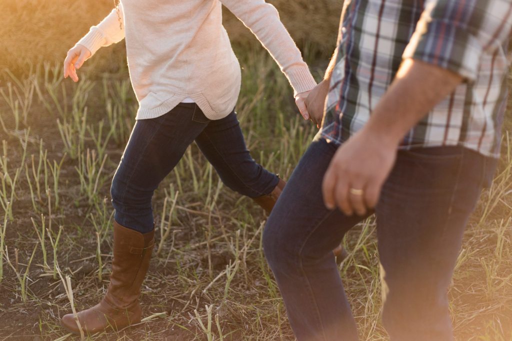 Couple holding hands walking